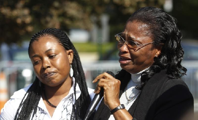 Plaintiff Esther Kiobel (R) speaks during a protest against Royal Dutch Shell Petroleum in front of the U.S. Supreme Court in Washington October 1, 2012.