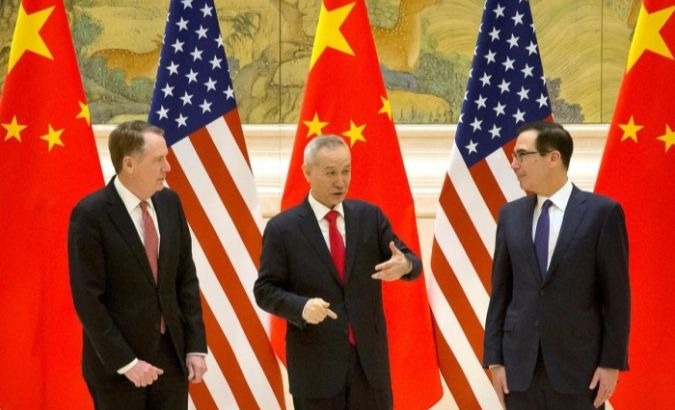 U.S. Trade Representative Robert Lighthizer (L), Chinese Vice Premier Liu He (C) and U.S. Treasury Secretary Steven Mnuchin interact during a two-day high-level consultation in Beijing.