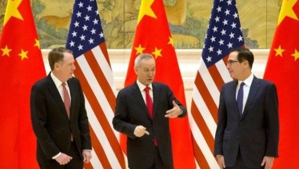 U.S. Trade Representative Robert Lighthizer (L), Chinese Vice Premier Liu He (C) and U.S. Treasury Secretary Steven Mnuchin interact during a two-day high-level consultation in Beijing. 