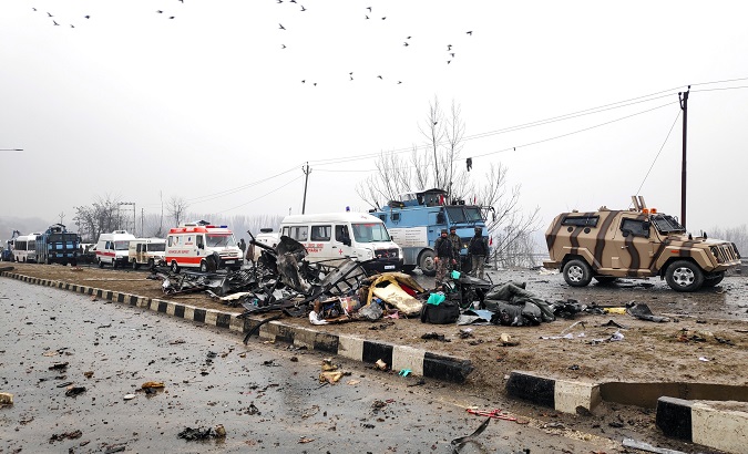 Indian soldiers examine the debris after an explosion in Lethpora in south Kashmir's Pulwama district.