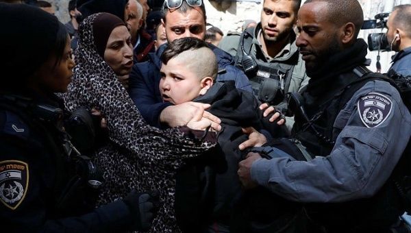 A Palestine kid is being harassed by Israeli police when he protested against his family's eviction. 