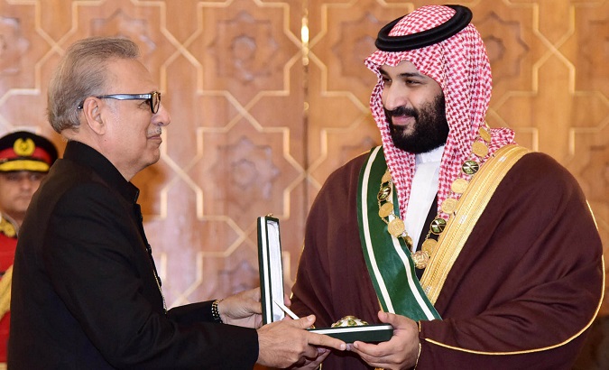 President Arif Alvi presents Pakistan's highest civil award Nishan-e-Pakistan to Saudi Arabian Crown Prince Mohammed bin Salman at the President House in Islamabad.
