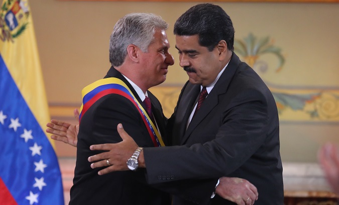 President Nicolas Maduro shakes hands with his Cuban counterpart Miguel Díaz-Canel during a state visit to Venezuela, May 30, 2018