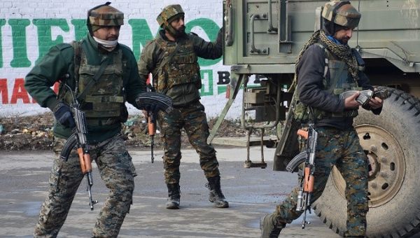 Indian Army soldiers arrive near the site of a gun battle between suspected militants and Indian security forces in Pinglan village in south Kashmir's Pulwama district Feb. 18, 2019.
