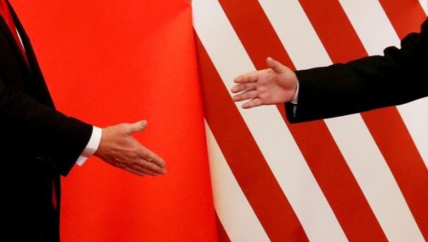U.S. President Donald Trump and China's President Xi Jinping shake hands after making joint statements at the Great Hall of the People in Beijing, China, November 9, 2017. 