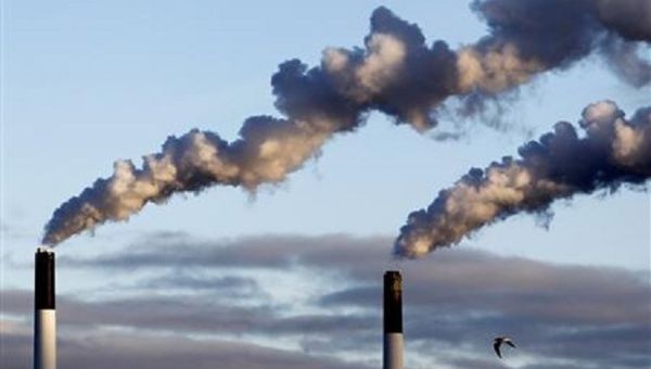 Greenhouse gases envelope the world's atmosphere in a molecular cloud of carbon dioxide, water vapor, methane, nitrous oxide, and oxone.
