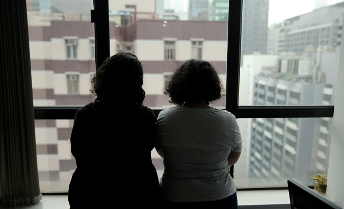 Sisters from Saudi Arabia, who go by aliases Reem and Rawan, are pictured at an office in Hong Kong, China.