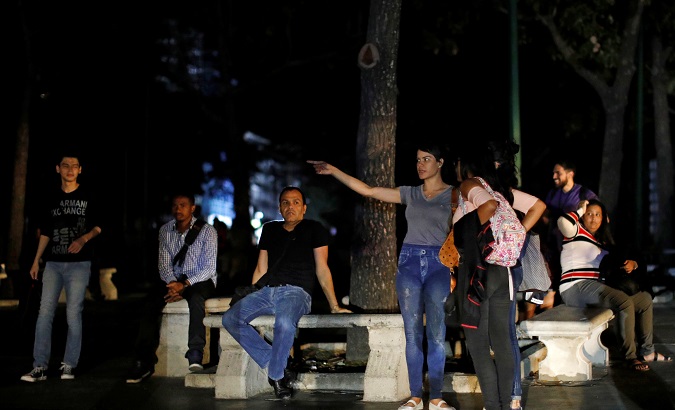 People gather at a park during the blackout in Caracas, Venezuela, March 7, 2019.