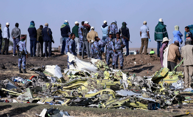 Ethiopian Federal policemen at the scene of the Ethiopian Airlines Flight ET 302 plane crash southeast of Addis Ababa, Ethiopia March 11, 201