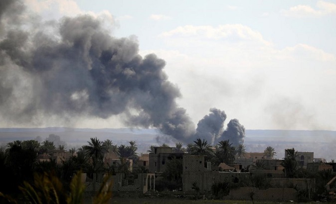 Black plumes of smoke rise in Baghouz, Deir Al Zor province, Syria March 3, 2019.