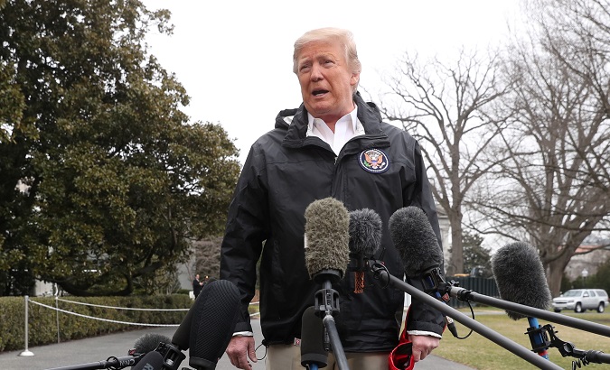 President Donald Trump talks to reporters in the White House in Washington, U.S., Mar. 8, 2019.