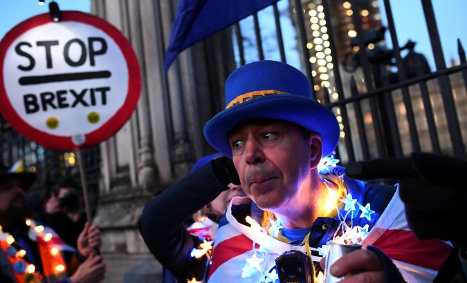Anti-Brexit supporters gather outside the Parliament in London, Britain March 12, 2019.