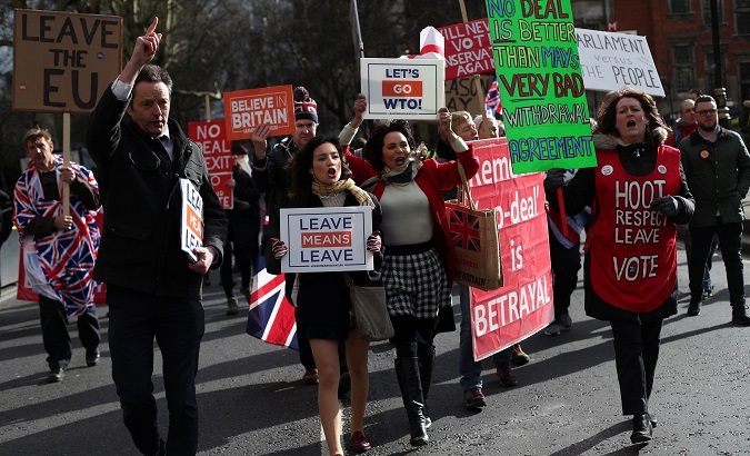Pro-Brexit protesters demonstrate outside the Houses of Parliament in London, UK, Mar. 13, 2019.