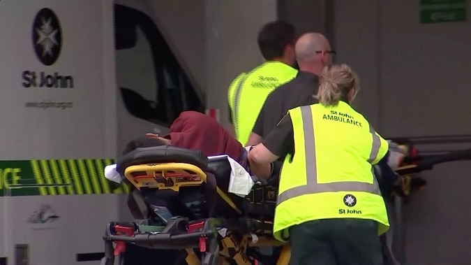 Emergency services personnel push stretchers carrying a person into a hospital, after reports that several shots had been fired, in central Christchurch, New Zealand March 15, 2019, in this still image taken from video.