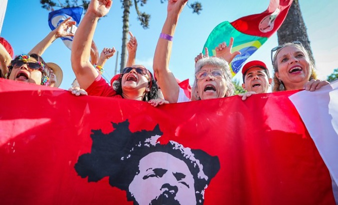 People shout slogans in Support of former President Lula at Lula Livre National Meeting held in Sao Paulo.