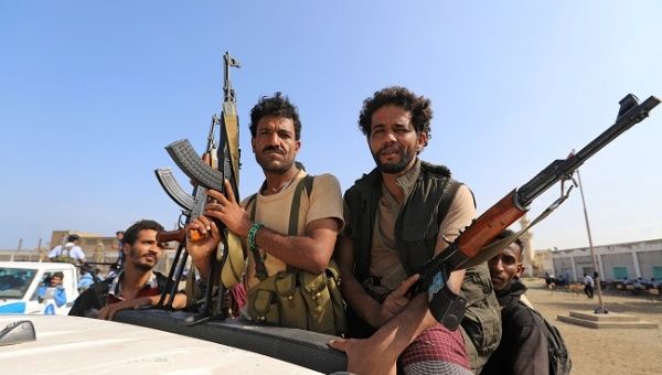 Houthi militants withdrawing on the back of a truck, part of a U.N.-sponsored peace agreement signed in Sweden earlier this month, Dec. 29, 2018
