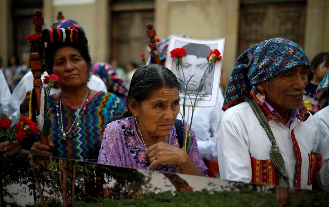 Indigenous people take part in a protest against a bill that would grant amnesty to war crimes committed during country's 36 year civil war outside the Congress, in Guatemala City, Guatemala March 13, 2019