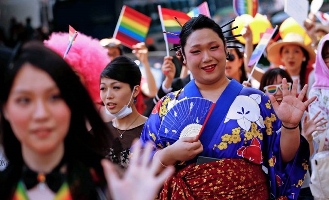 Emerging trouble: A reveler waves during the Tokyo Rainbow Pride parade celebrating lesbian, gay, bisexual and transgender (LGBT) culture in Tokyo.