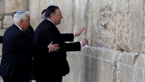 Israeli Prime Minister Benjamin Netanyahu, U.S. Secretary of State Mike Pompeo and U.S. Ambassador to Israel David Friedman touch the stones of the Western Wall during a visit to the site in Jerusalem's Old City March 21, 2019. 