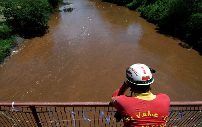 A rescue worker reacts during a demonstration in honor of victims of the collapse of a dam owned by Brazilian mining company Vale SA, in Brumadinho, Brazil Feb. 25, 2019.