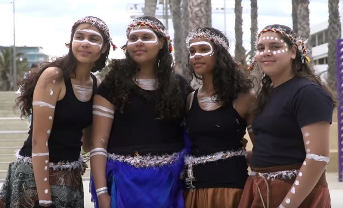 Young Indigenous women with Culture is Life, advocating for youth suicide prevention in Aboriginal and Torres Strait Islander communities.