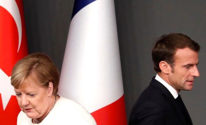German Chancellor Angela Merkel (pictured with French President Emmanuel Macron) added six months to Saudi arms export ban upsetting France and Britain.