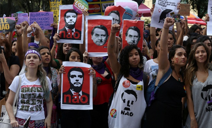 People demonstrate against presidential candidate Jair Bolsonaro in Rio de Janeiro, Brazil, Sept. 29, 2018.