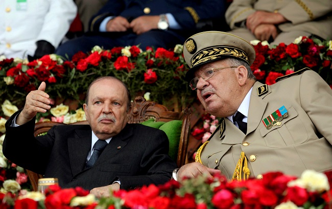 Algeria's President Abdelaziz Bouteflika gestures while talking with Army Chief of Staff General Ahmed Gaed Salah, Algeria June 27, 2012.