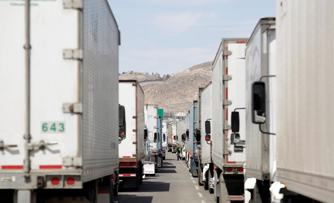Trucks wait in a long queue for border customs control to cross into U.S., caused by the redeployment of border officers Ciudad Juarez, Mexico April 2, 2019.