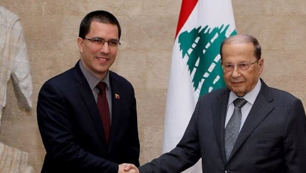 Lebanese President Michel Aoun is pictured with Venezuela's Minister of Foreign Affairs Jorge Arreaza at the presidential palace in Baabda.