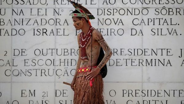 An Indigenous man protests against the transfering of healthcare services from the federal level to municipal governments, in Brasilia, Brazil, March 26, 2019.