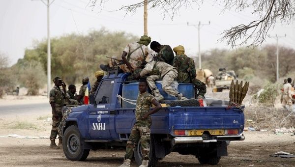  Chadian soldiers, part of a West African task force fighting Boko Haram militants, sit in a truck in Damasak, in northeastern Nigeria.