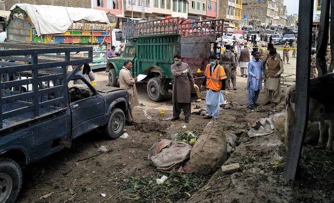 A Pakistani bomb disposal unit survey the site after a blast at a vegetable market in Quetta, Pakistan April 12, 2019.