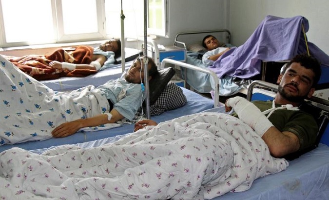 Wounded Afghan men receive treatment at a hospital one day after the start of the Taliban spring offensive, in Kunduz province, Afghanistan April 13, 2019.