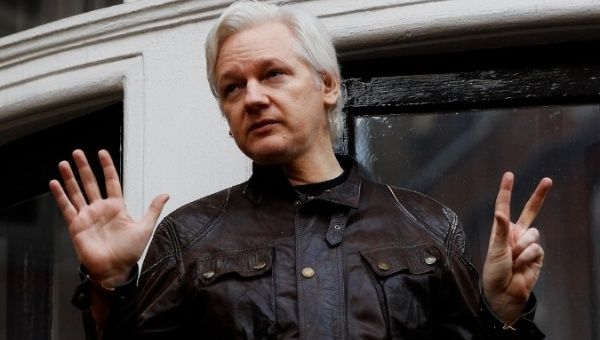 Wikileaks founder Julian Assange is pictured on the balcony of the Ecuadorean Embassy in London.