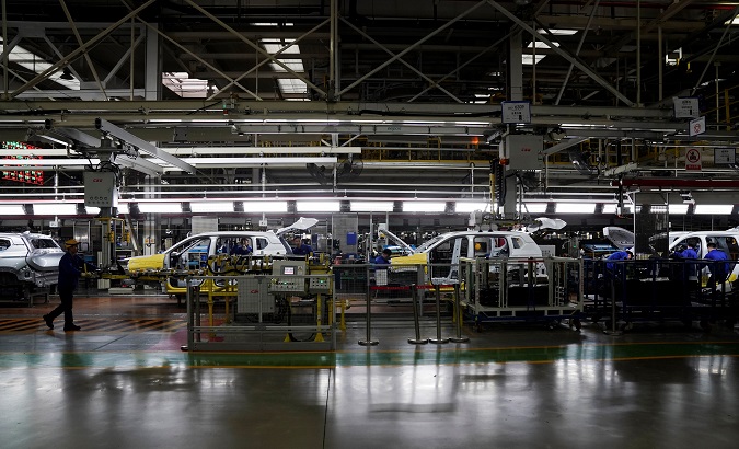Employees work on Baojun RS-5 cars at a final assembly plant operated by General Motors Co and its local joint-venture partners in Liuzhou, Guangxi Zhuang Autonomous Region, China, February 28, 2019