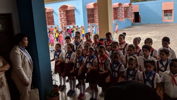New Orleans Mayor LaToya Cantrell meets with children at a primary school in Cuba.