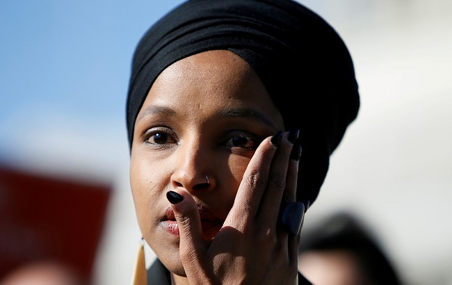 Rep. Omar wipes tears from her eye as she speaks about Trump administration policies towards Muslim immigrants at a news conference outside the U.S. Capitol in Washington