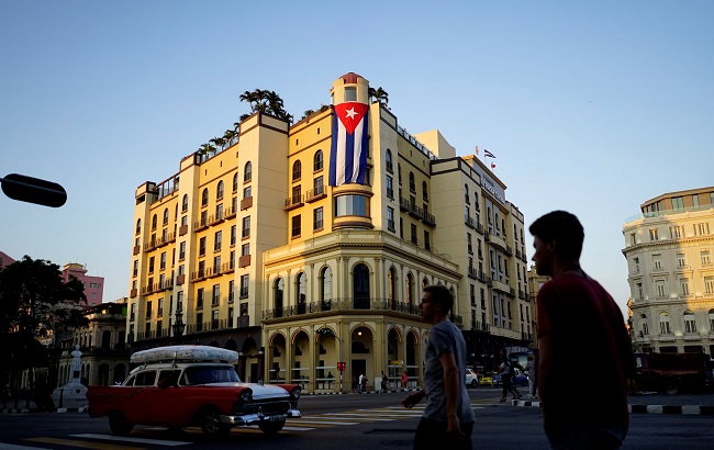 A Cuban flag hangs outside a hotel in Havana, Cuba, April 20, 2018.