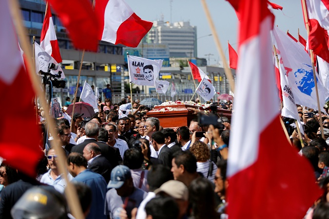 Friends and family carry the coffin of Peru's former President Garcia during the last of three days of national mourning Friday.