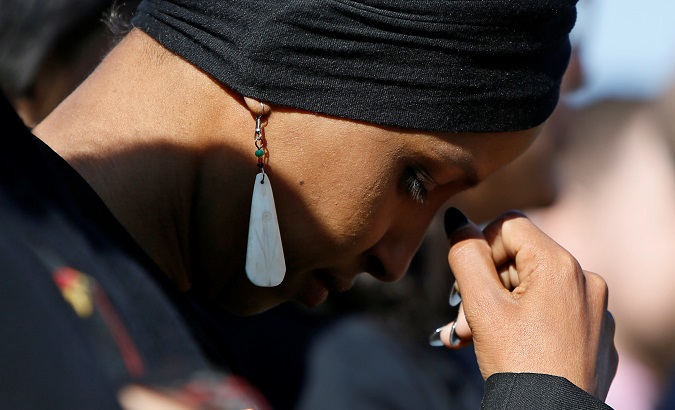 Rep. Omar pauses in thought during at a news conference about Trump administration policies towards Muslim immigrants outside the U.S. Capitol in Washington