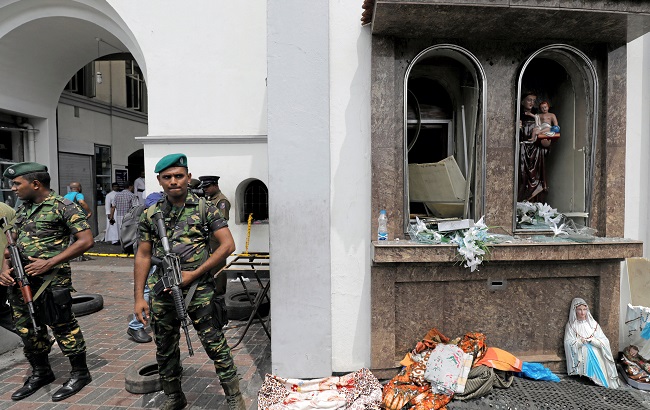Sri Lankan military officials stand guard in front of the St. Anthony's Shrine, Kochchikade church after an explosion in Colombo, Sri Lanka