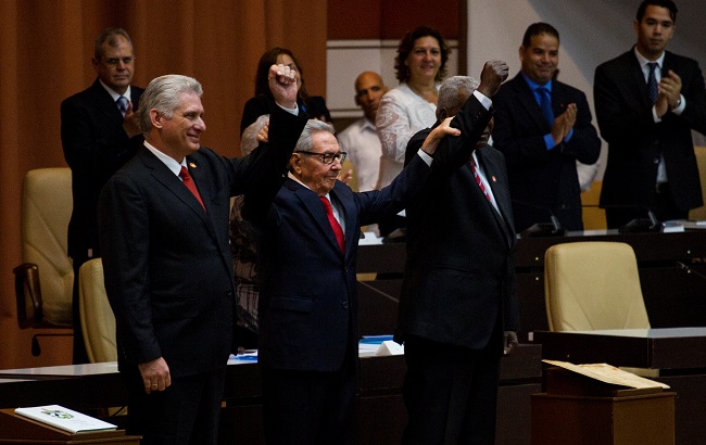 Cuban President Miguel Diaz-Canel, Cuban Communist Party leader Raul Castro and National Assembly President Esteban Lazo react during the enactment of the new constitution, in Havana