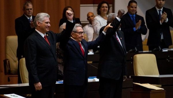 Cuban President Miguel Diaz-Canel, Cuban Communist Party leader Raul Castro and National Assembly President Esteban Lazo react during the enactment of the new constitution, in Havana