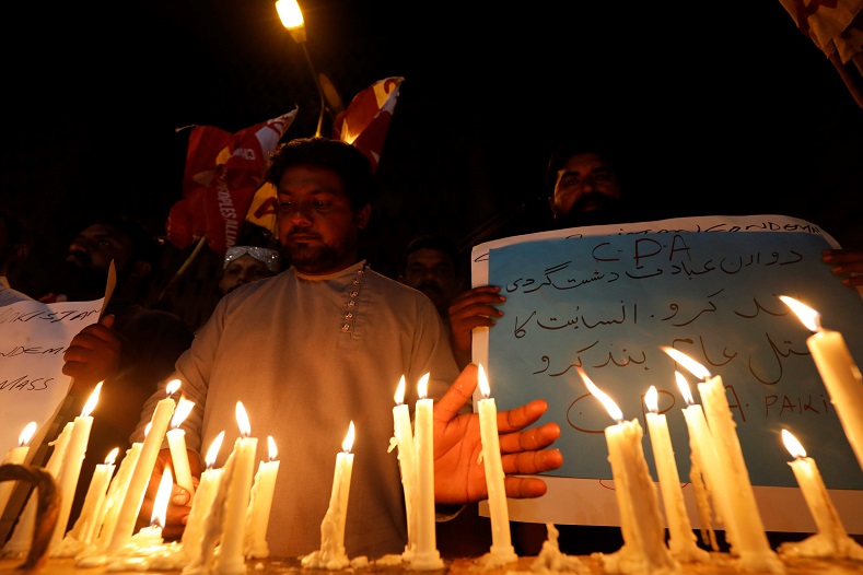 People light candles for the victims of Sri Lanka's serial bomb blasts, in Karachi, Pakistan April 21, 2019.