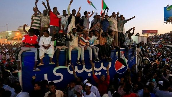 Sudanese demonstrators chant slogans as they attend a mass anti-government protest outside Defence Ministry in Khartoum