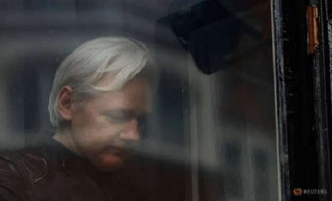 WikiLeaks founder Julian Assange is seen on the balcony of the Ecuadorian Embassy in London, Britain, May 19, 2017.