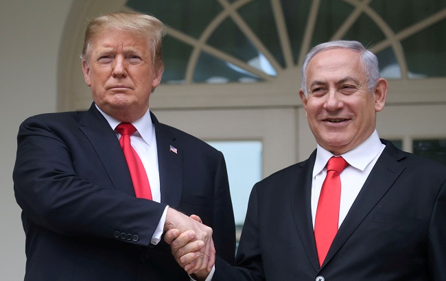 U.S. President Donald Trump shakes hands with Israel's Prime Minister Benjamin Netanyahu, White House in Washington, U.S., March 25, 2019