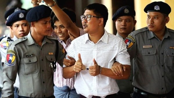 Detained Reuters journalists Wa Lone and Kyaw Soe Oo arrive at Insein court in Yangon, Myanmar, Aug. 27, 2018.