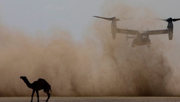 A U.S. Marine MV-22 Osprey with the 22nd Marine Expeditionary Unit lands before offloading Marines and Sailors as part of embassy reinforcement training during an exercise at Camp Beuhring, Kuwait